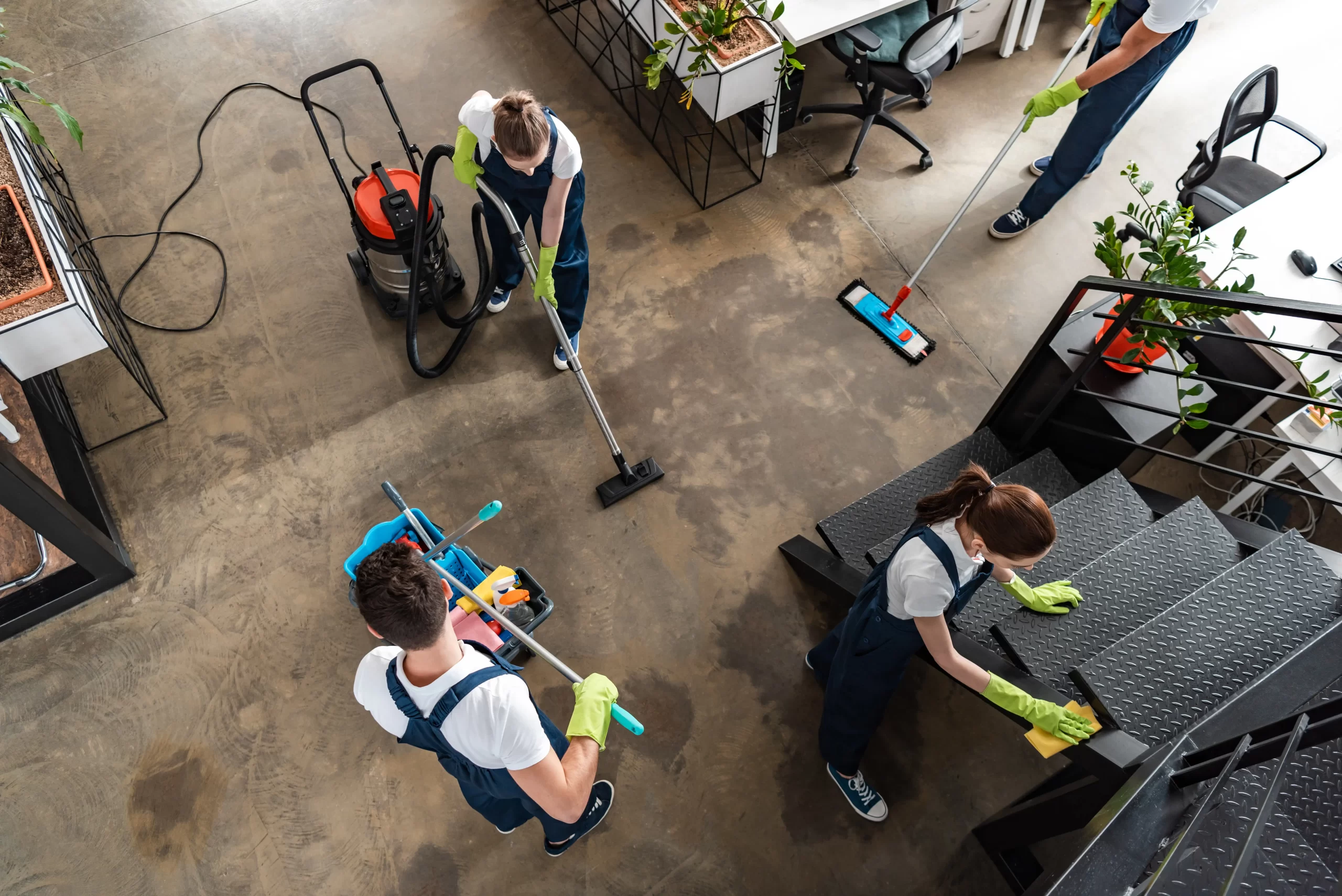 A top view of cleaning workers cleaning the office.